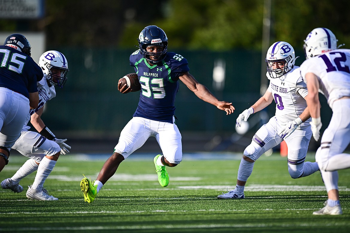 Glacier running back Kobe Dorcheus (33) picks up yardage on a run in the first quarter against Butte at Legends Stadium on Friday, Sept. 13. (Casey Kreider/Daily Inter Lake)