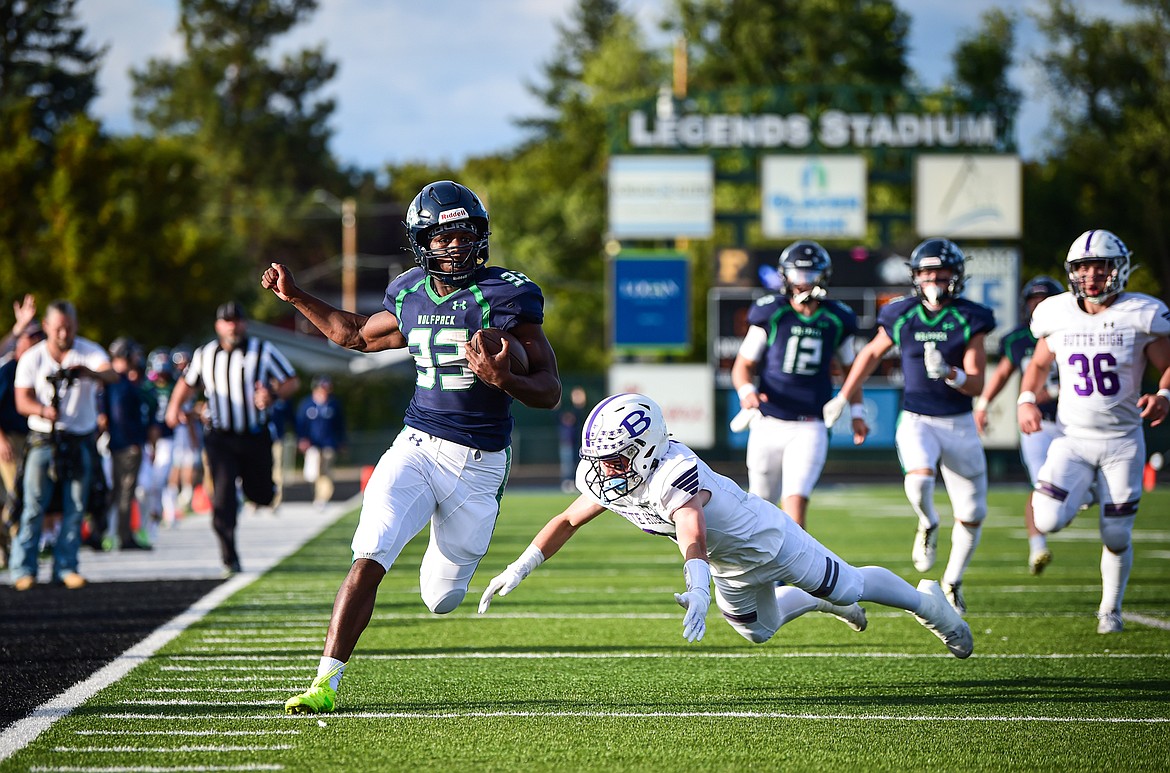 Glacier running back Kobe Dorcheus (33) scores a touchdown on a 65-yard run in the first quarter against Butte at Legends Stadium on Friday, Sept. 13. (Casey Kreider/Daily Inter Lake)