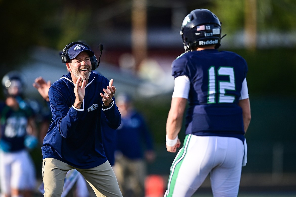 Glacier head coach Grady Bennett congratulates quarterback Jackson Presley (12) after throwing a touchdown pass to wide receiver Cooper Pelc in the first quarter against Butte at Legends Stadium on Friday, Sept. 13. (Casey Kreider/Daily Inter Lake)