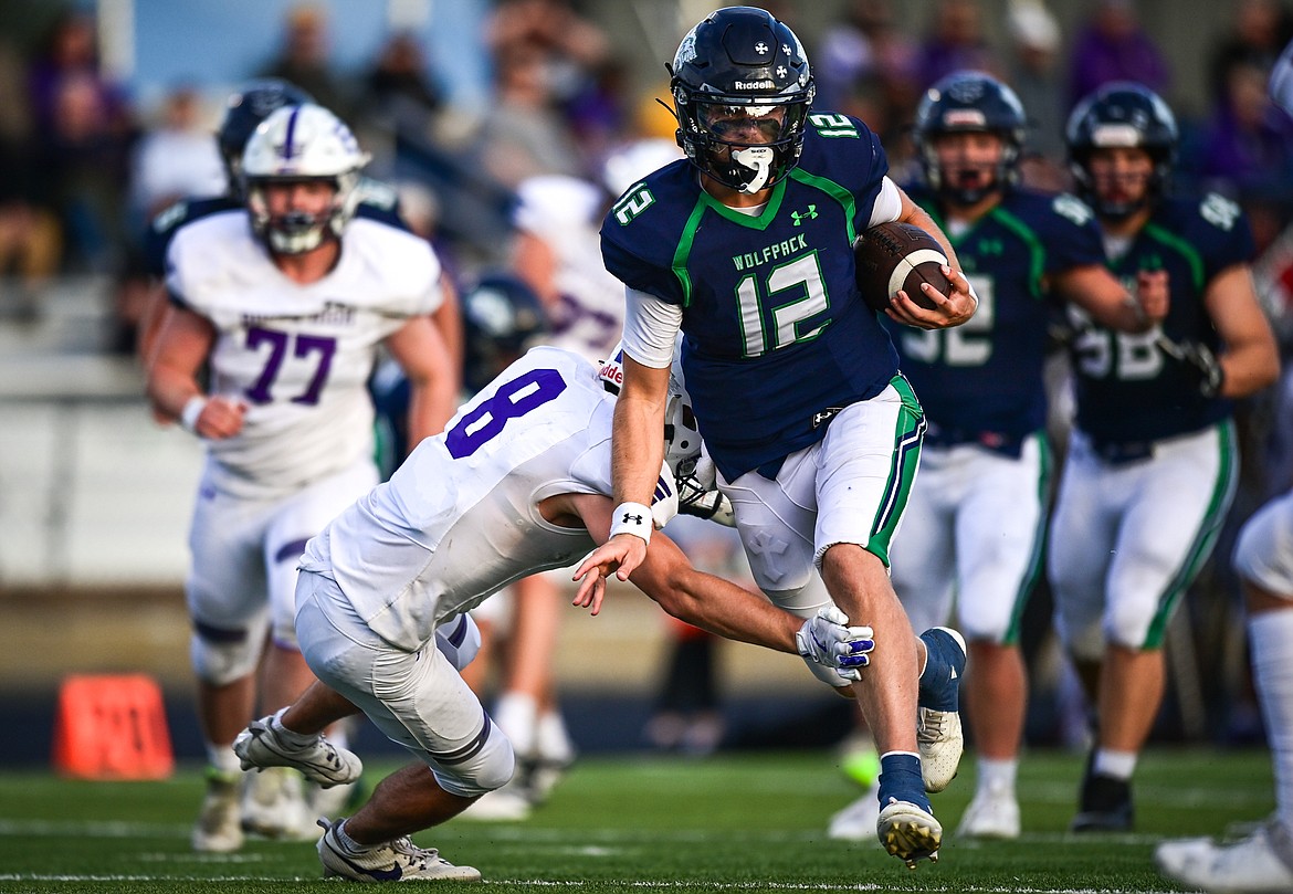 Glacier quarterback Jackson Presley (12) runs for an 11-yard touchdown in the second quarter against Butte at Legends Stadium on Friday, Sept. 13. (Casey Kreider/Daily Inter Lake)