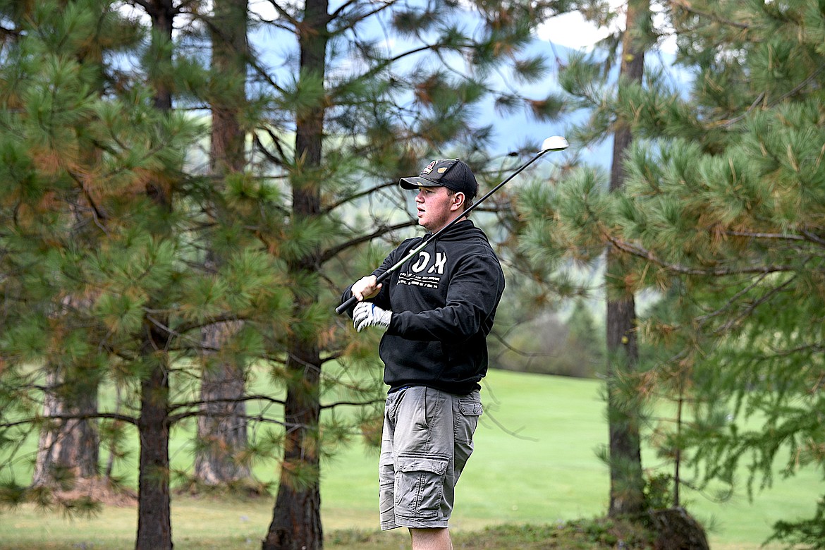 Libby's Degan Quinn watches his tee shot on No. 5 Friday, Sept. 13, 2024, at Cabinet View Golf Course. (Scott Shindledecker/The Western News)