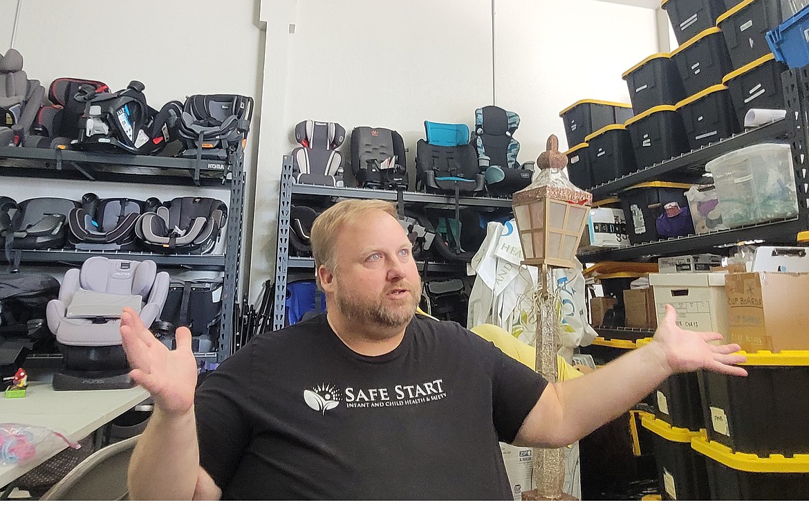 Brian Rauscher, director of operations for Safe Start, is seen Tuesday in the nonprofit's warehouse in Coeur d'Alene. Safe Start's Rural Education Outreach team is traveling throughout North Idaho to conduct free car seat checks for families in small communities.