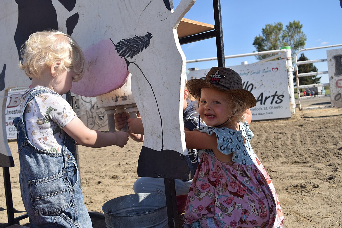 Participants at the Rascal Rodeo, an all-ages adaptive rodeo for people with disabilities milked a cardboard cow on Sept. 13.