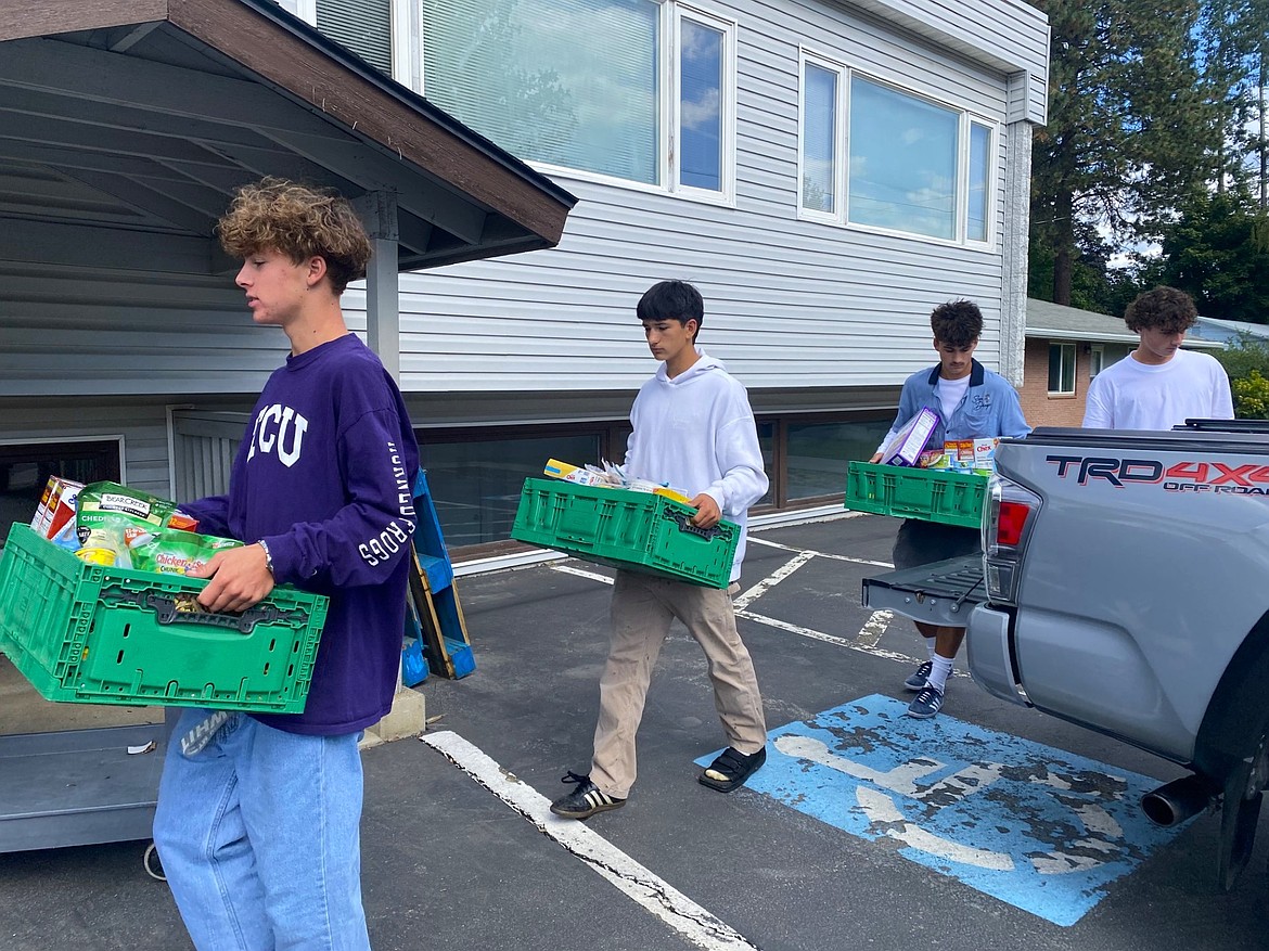 Members of Coeur d'Alene High School's varsity boys soccer team brought several crates of non-perishable food donations to the Canvas Food Pantry on Friday.