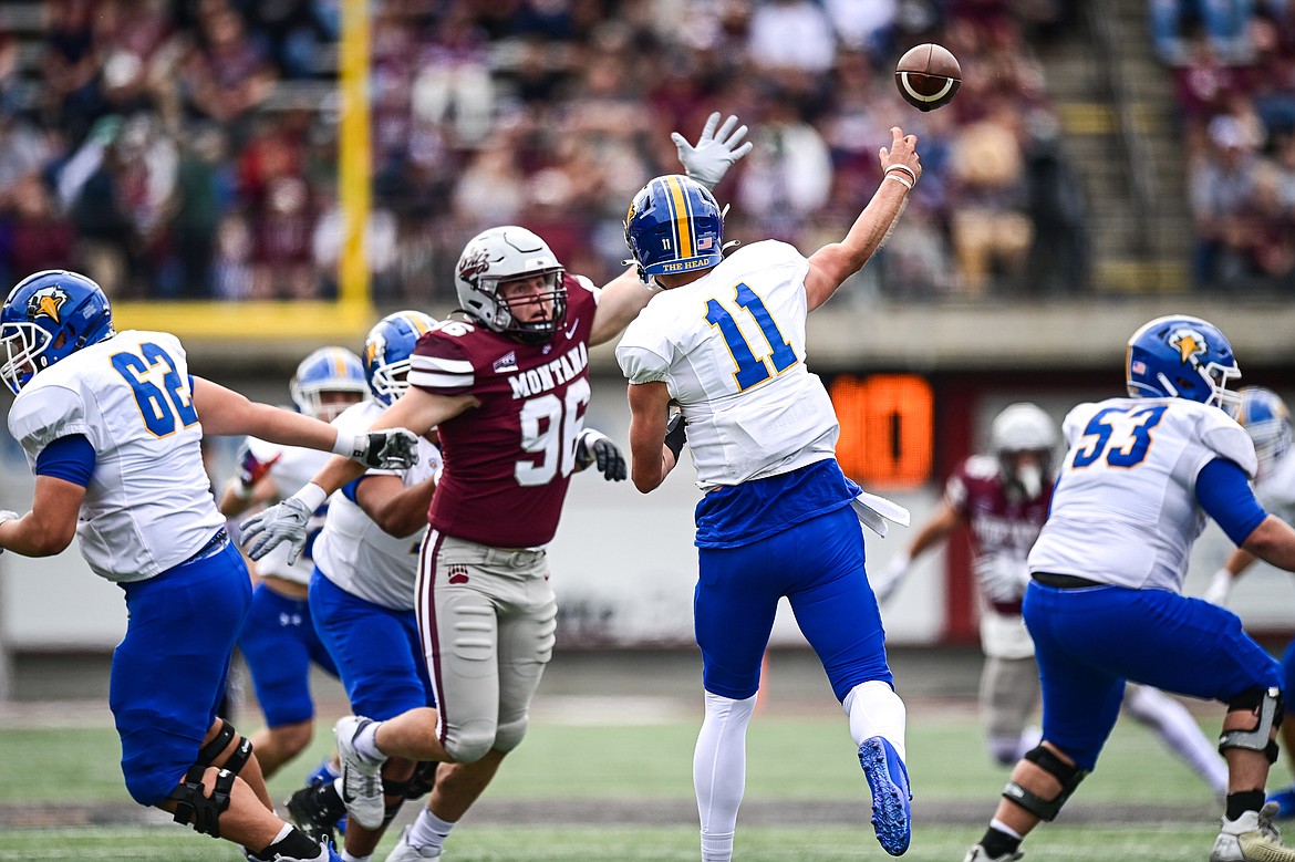 Grizzlies defensive lineman Henry Nuce (96) puts pressure on Morehead State quarterback Connor Genal (11) in the first quarter on Saturday, Sept. 14. (Casey Kreider/Daily Inter Lake)