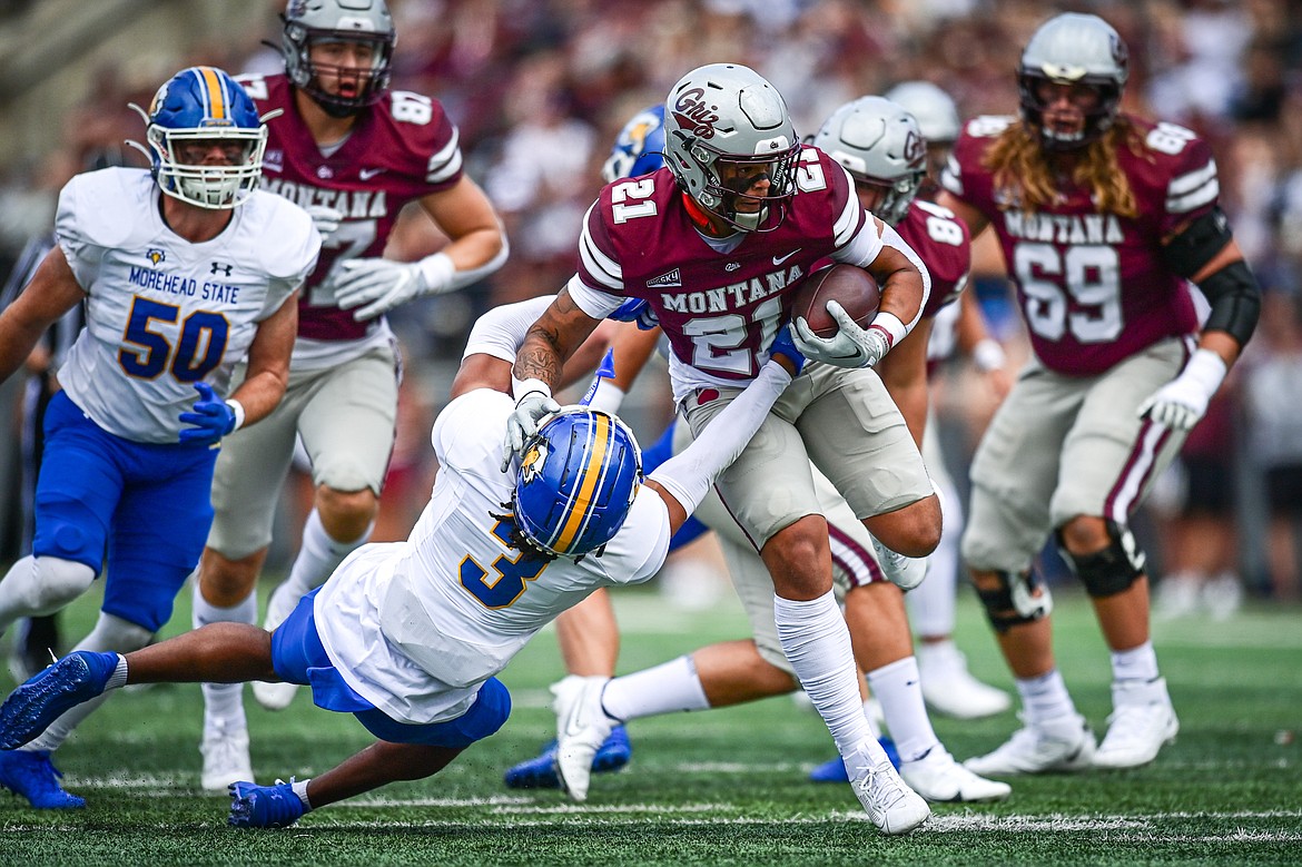 Grizzlies running back Stevie Rocker Jr. (21) picks up yardage on run in the second quarter against Morehead State on Saturday, Sept. 14. (Casey Kreider/Daily Inter Lake)