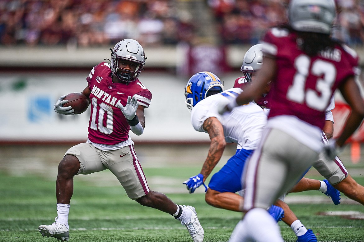 Grizzlies running back Eli Gillman (10) picks up yardage on a run in the first quarter against Morehead State on Saturday, Sept. 14. (Casey Kreider/Daily Inter Lake)