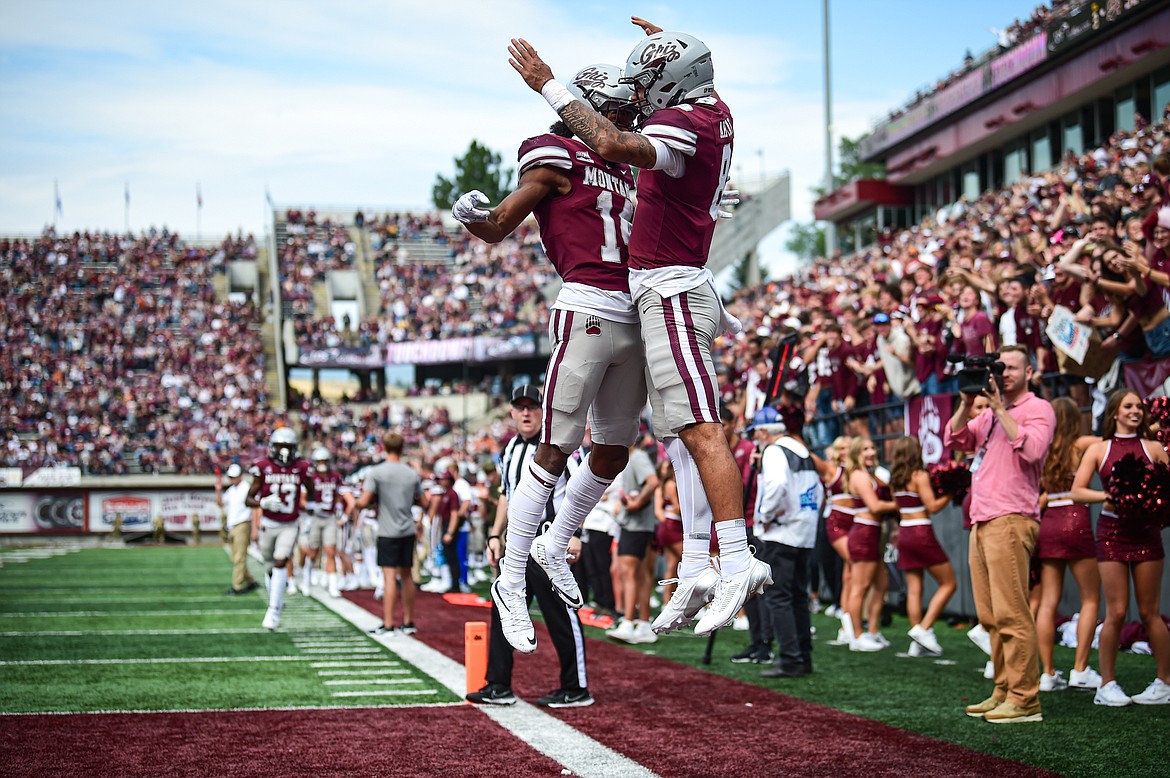 Grizzlies quarterback Keali'i Ah Yat (8) celebrates with wide receiver Aaron Fontes (18) after Ah Yat's 2-yard touchdown run in the third quarter against Morehead State on Saturday, Sept. 14. (Casey Kreider/Daily Inter Lake)