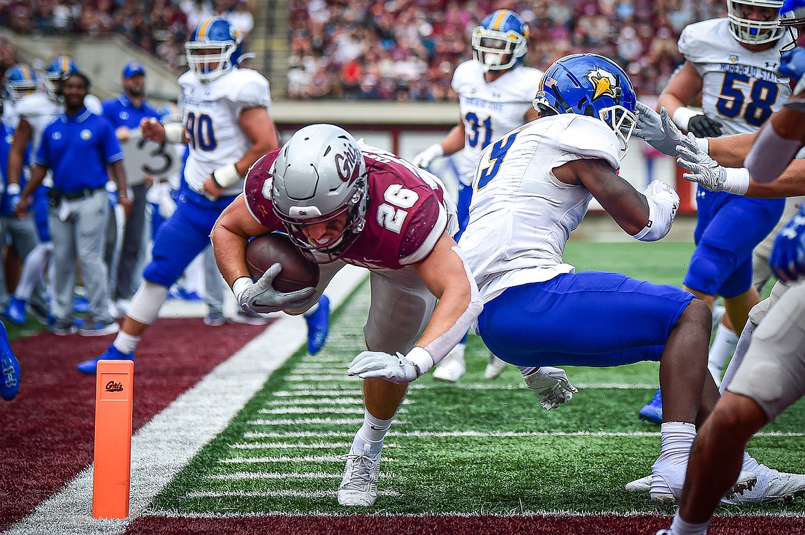 Grizzlies running back Nick Ostmo (26) scores a touchdown on a 10-yard run in the second quarter against Morehead State on Saturday, Sept. 14. (Casey Kreider/Daily Inter Lake)