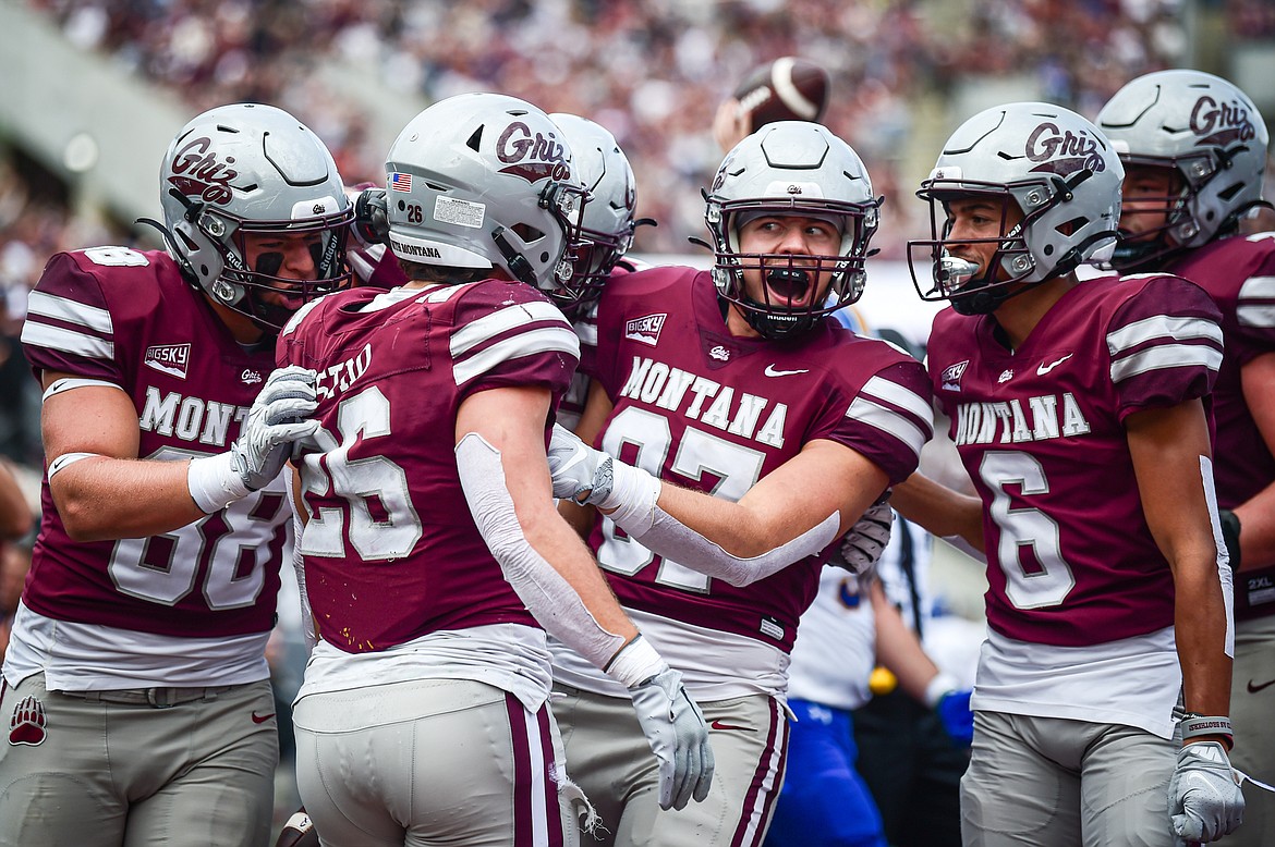 The Grizzlies celebrate after running back Nick Ostmo's (26) 10-yard touchdown run in the second quarter against Morehead State on Saturday, Sept. 14. (Casey Kreider/Daily Inter Lake)