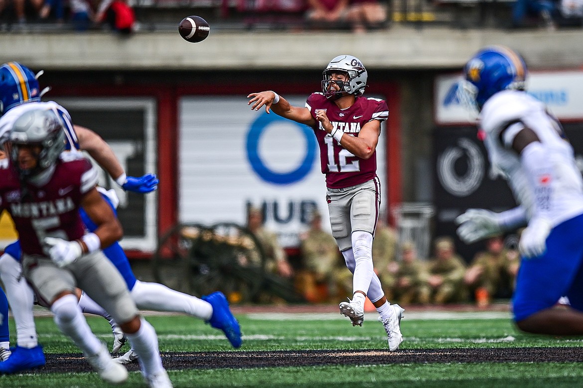 Grizzlies quarterback Logan Fife (12) completes a 15-yard pass to running back Stevie Rocker Jr. in the second quarter against Morehead State on Saturday, Sept. 14. (Casey Kreider/Daily Inter Lake)