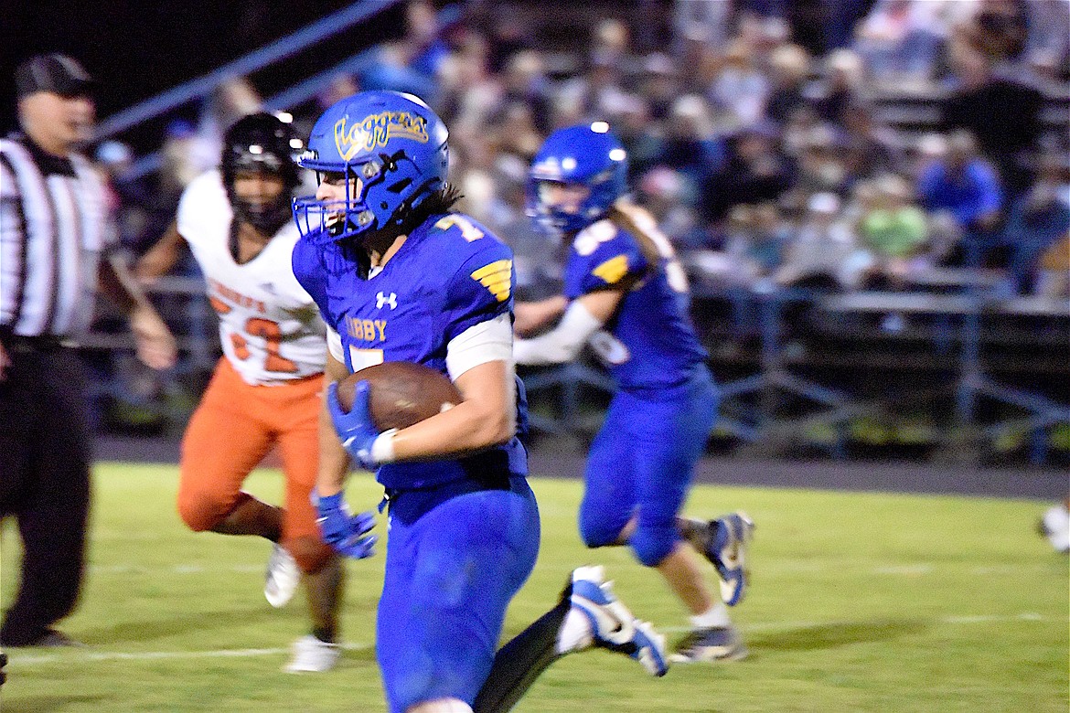 Libby's Ian Thom runs with the ball Friday, Sept. 13, 2024, against Ronan at Loggers Stadium. (Scott Shindledecker/The Western News)