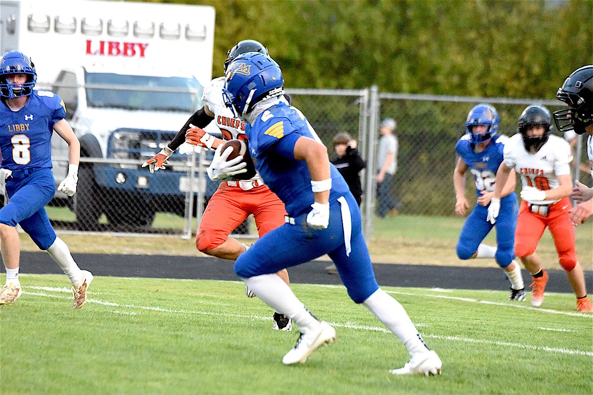 Libby's Isaac Lamere runs with the ball after catching a pass Friday, Sept. 13, 2024, against Ronan at Loggers Stadium. (Scott Shindledecker/The Western News)