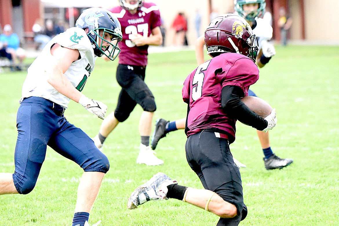 Troy sophomore Mason Crowe runs away from a defender after catching a pass Saturday, Sept. 14, 2024, against Valley Christian. (Scott Shindledecker/The Western News)