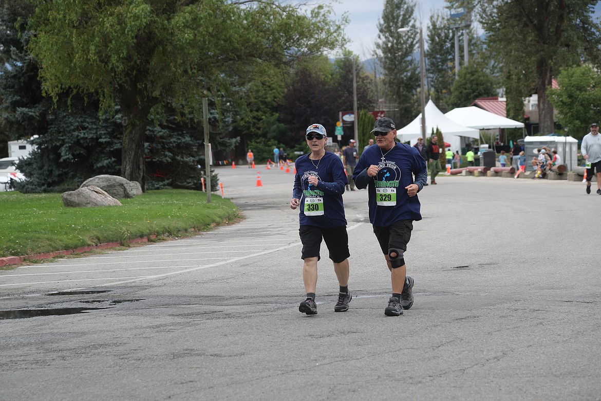 Alesia Leblanc and Jeffrey Leblanc approach the finish line of the 5K race in the Find Your Strength Family Fun Run.