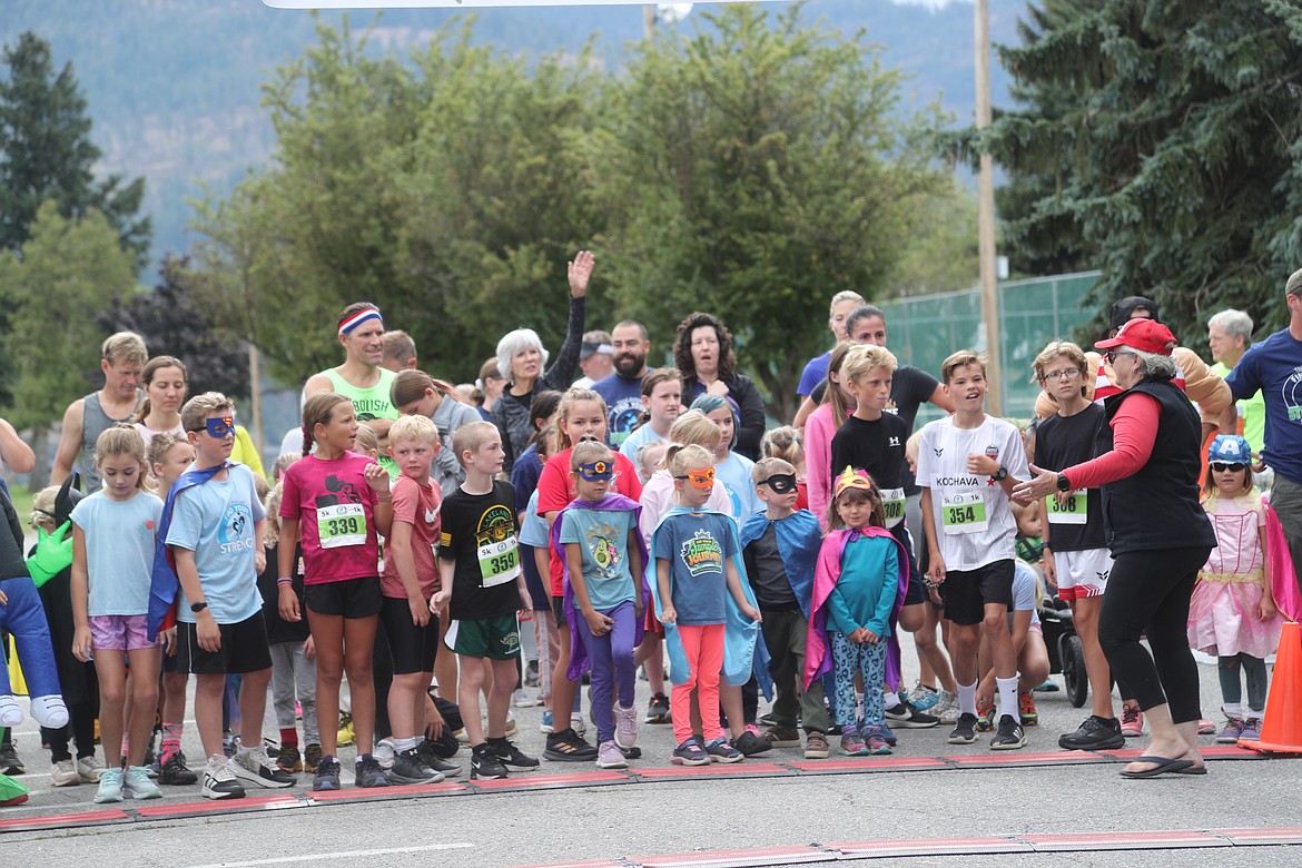 Find Your Strength Family Fun Run 1K racers wait for the start of the race.