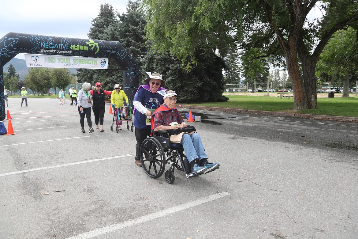 Steve and Richard Neuder take off from the starting line at the start of the 1K race as part of the Find Your Strength Family Fun Run on Saturday.