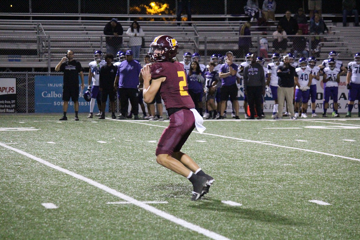 Mavericks quarterback Brady Jay goes back to pass in Moses Lake’s win Friday.