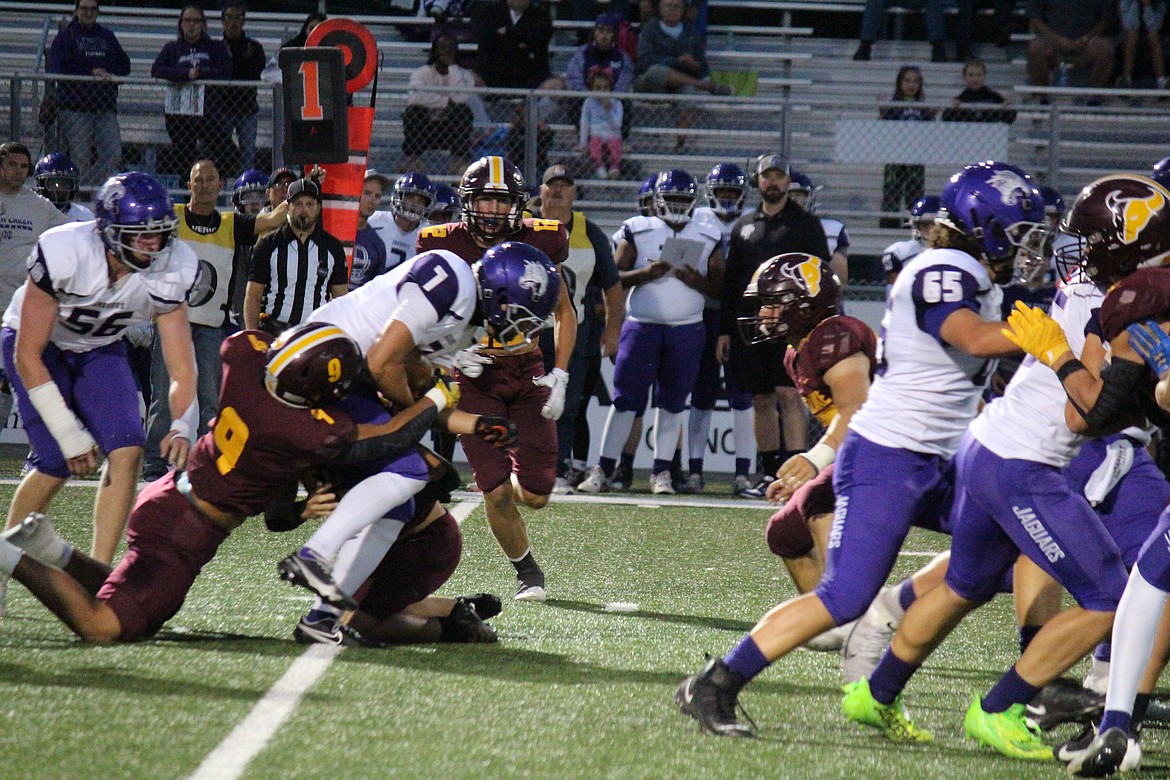 The Moses Lake defense wraps up the North Creek quarterback.