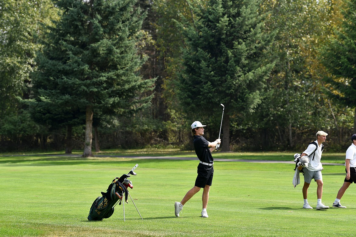 Bulldog CJ Threw (center) pairs off with Glacier player Torren Murray and Flathead player Korbin Eaton at the Whitefish Triangular golf invite. (Kelsey Evans/Whitefish Pilot)