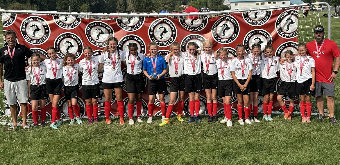 The 2013 Sandpoint Strikers (Red) girls' soccer team won the gold division of the Pend Oreille Cup. From left to right are coach Adam Tajan, Jayla Hatfield, Addison Sweeney, Finley Williams, Jenna Baroni, Keely Lett, Brooklyn Windju, Presley Powell, Scarlett Whitehouse, Elsa Gidley, Harper Mangano, Olivia Watson, Nina Tajan, Halle Anderson, Claire LeBaron, Maci Brandtner, Sylvia Nees and coach Luke Anderson.