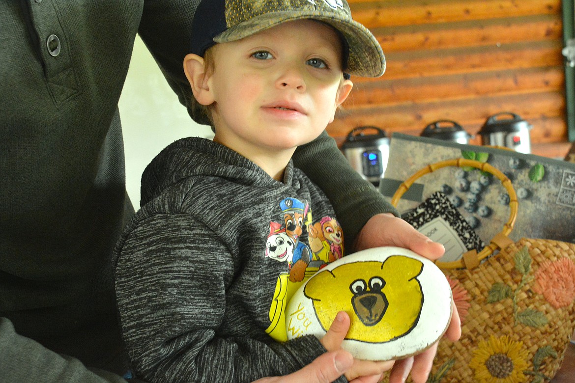 Two-year0old Oryn was happy with his big golden rock bear. (Mineral Independent/Amy Quinlivan)