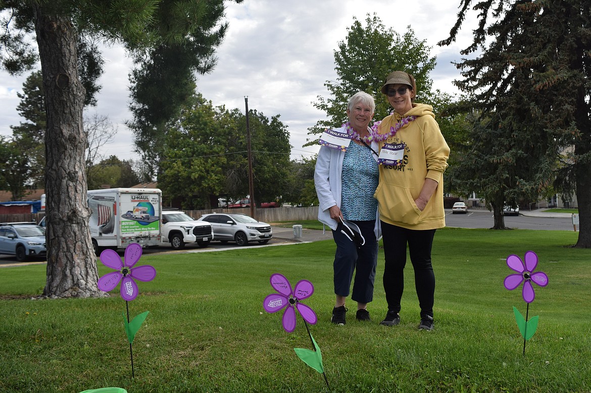 Connie Meier, left, and Michele Jacobson, right, walked for the first time at the Walk to End Alzheimer's. They said they were walking for Mike Meier, Connie’s husband and a family friend, Norma Pittman.