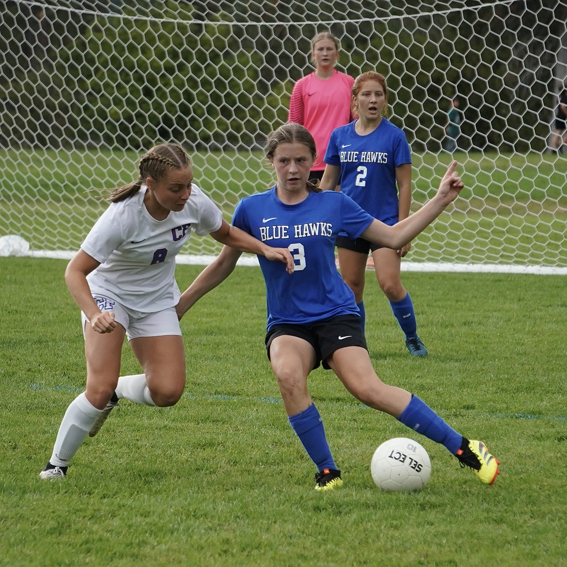 Thompson Falls soccer player Callie McGillis (3) tries to get past a Columbia Falls player during their match this past Saturday in Thompson Falls. (Photo by Erika Lawyer)