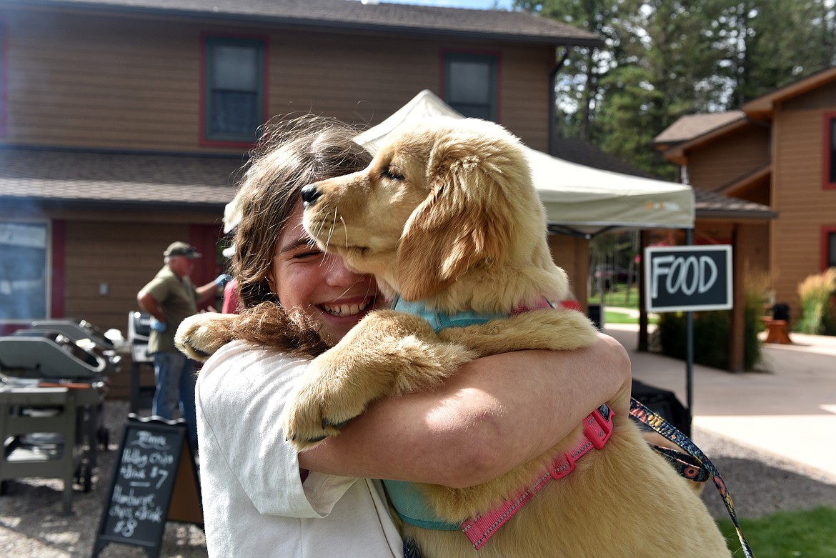 Adel Brigette from Whitefish has her arms full with Honey Bear. (Kelsey Evans/Whitefish Pilot)