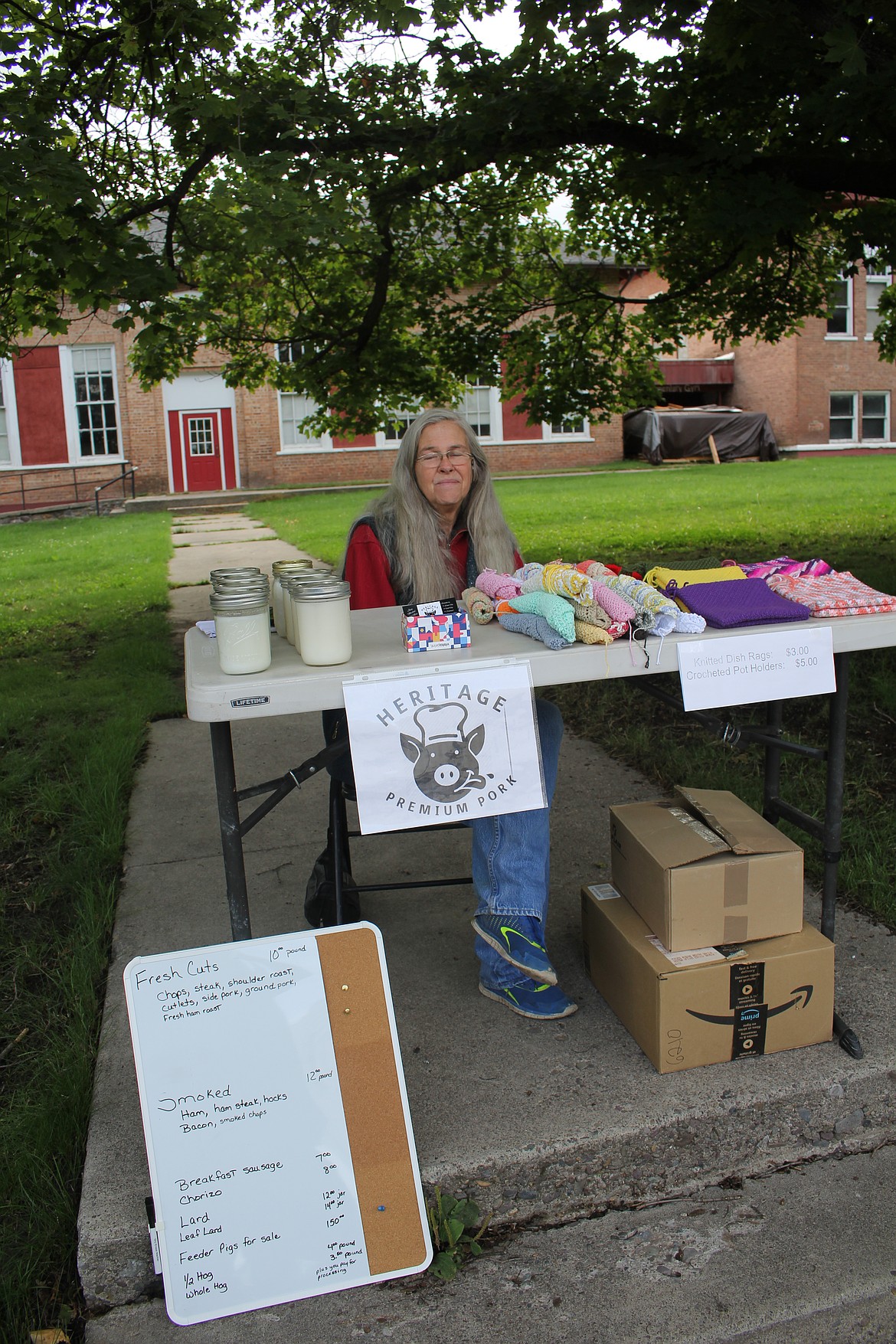 Chris Hitchcock with Heritage Premium Pork in Tarkio has been a staple of the Superior Saturday Market and said that this year has been her busiest believing that the Shyrock RV Community off of east Mullan has been a big factor in her sales. (Monte Turner/Mineral Independent)