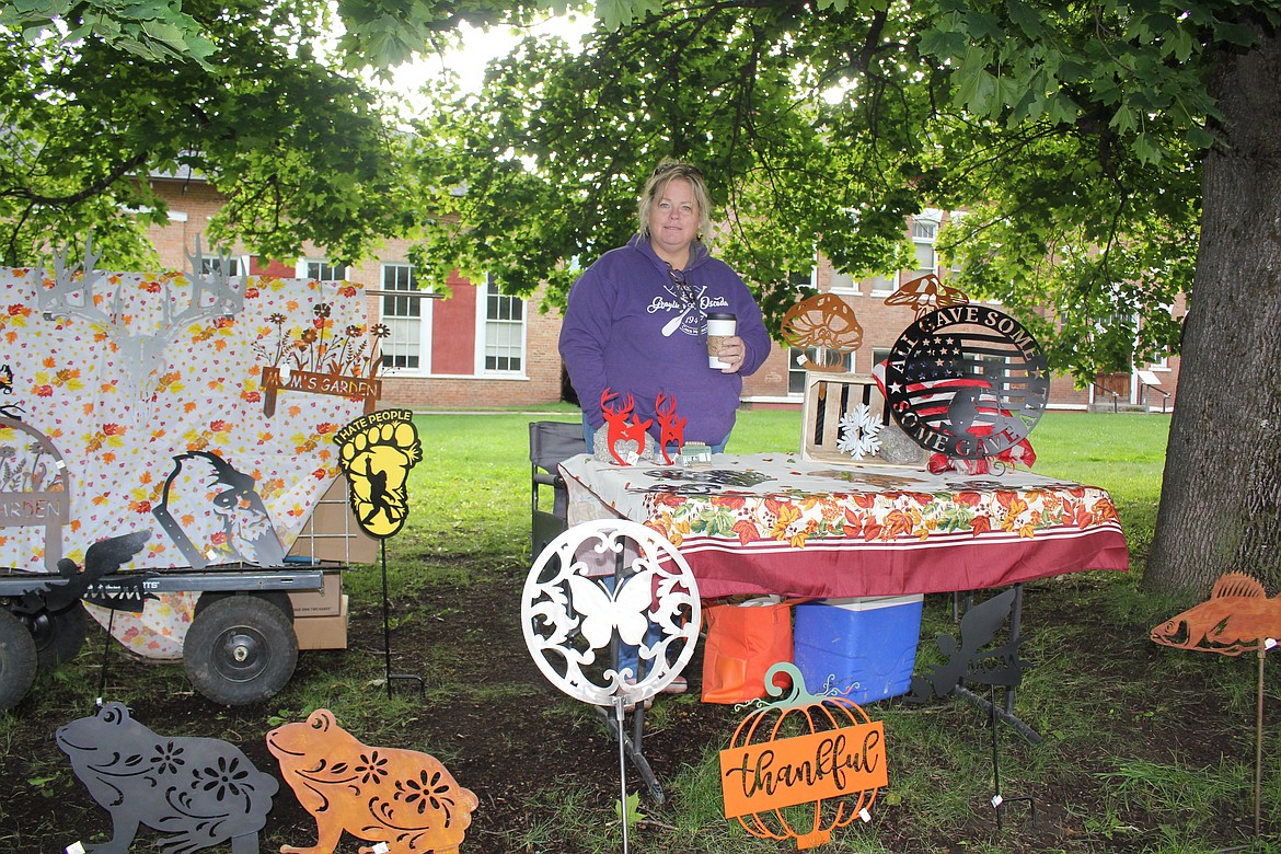 The Superior Saturday Market closes Sept. 28, and Jill Davis, owner of Wood and Welding Custom Metal Signs said that this year has been good for her business. Once a commercial gardener she went from farm equipment to plasma cutting when she moved to Superior. (Monte Turner/Mineral Independent)