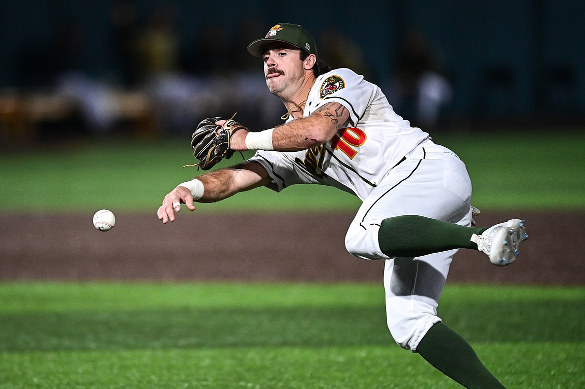 Glacier second baseman Gabe Howell (10) throws to first after bare-handing a slow-roller against Yolo during Game 1 of the Pioneer League Championship Series at Glacier Bank Park on Tuesday, Sept. 17. (Casey Kreider/Daily Inter Lake)