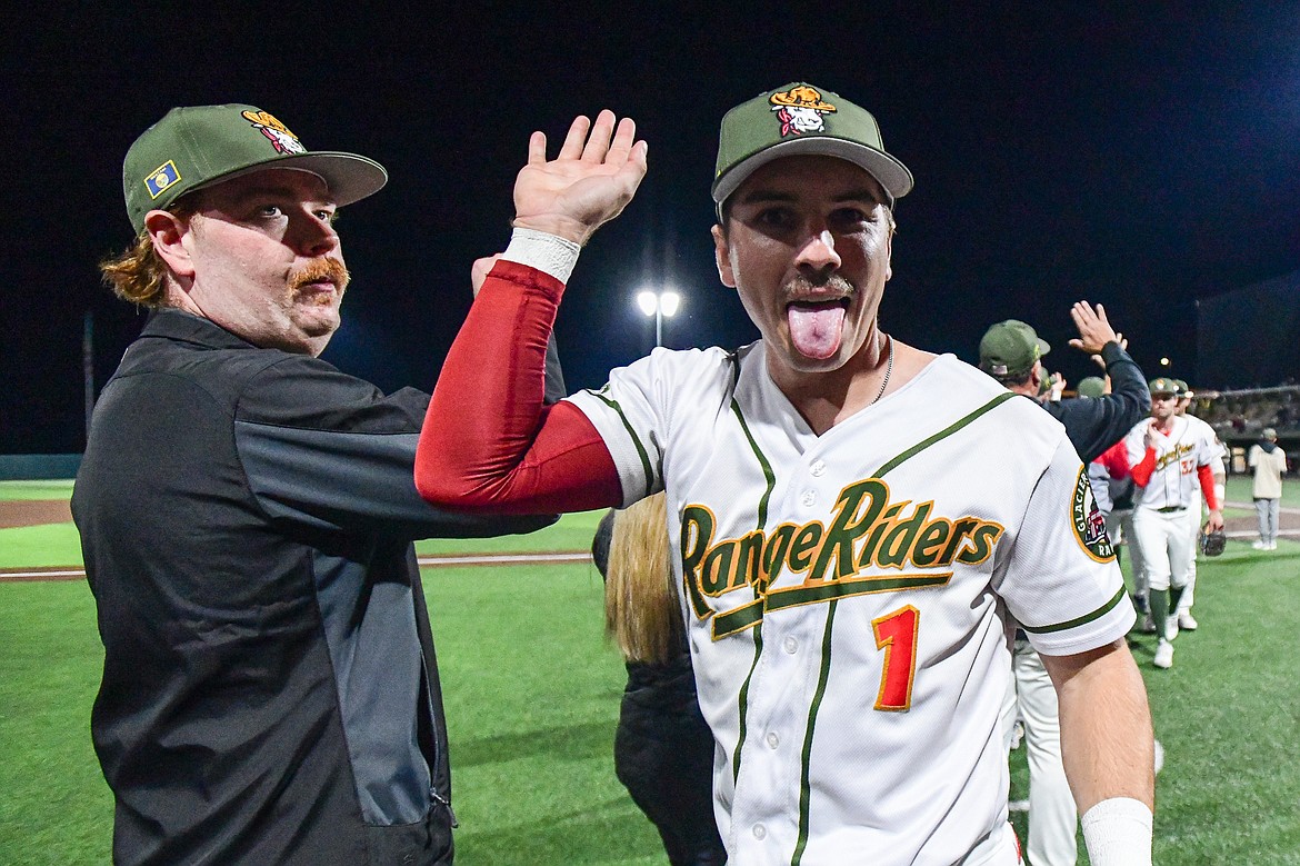 Glacier's Christian Kirtley (1) and teammates high-five after a 2-0 win over Yolo in Game 1 of the Pioneer League Championship Series at Glacier Bank Park on Tuesday, Sept. 17. (Casey Kreider/Daily Inter Lake)