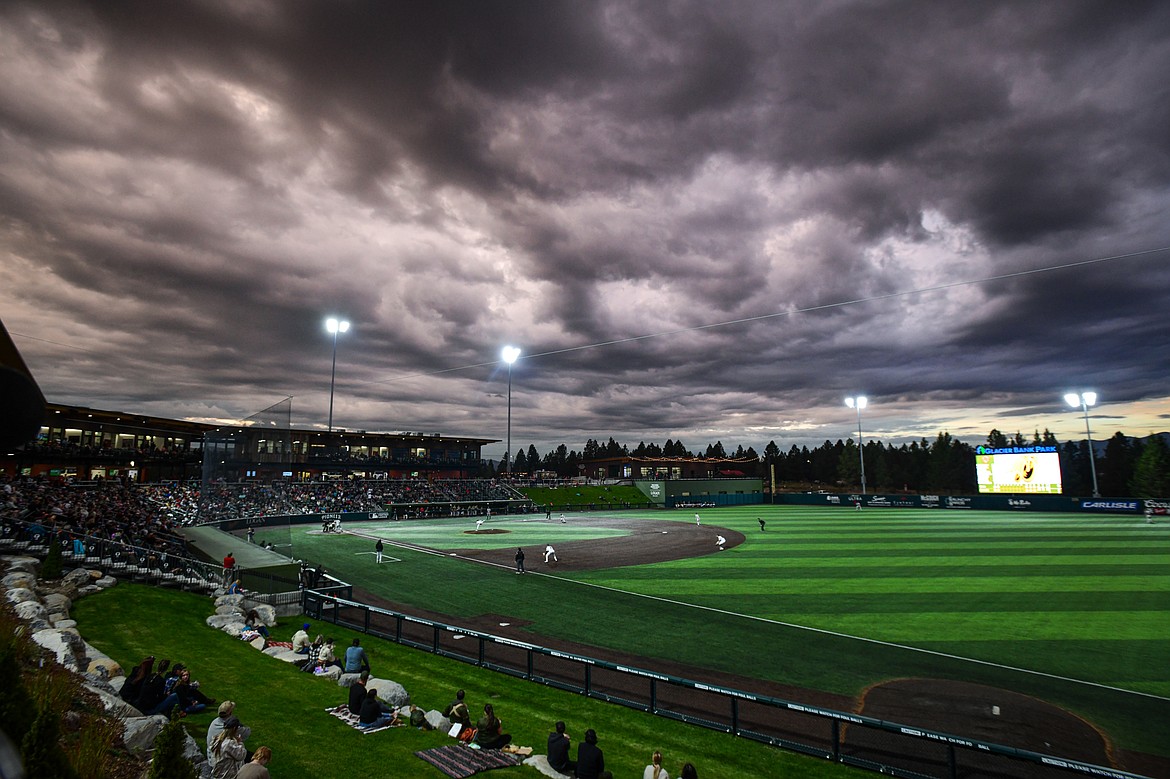 Dark clouds move across the sky over Glacier Bank Park during Game 1 of the Pioneer League Championship Series between the Glacier Range Riders and Yolo High Wheelers on Tuesday, Sept. 17. (Casey Kreider/Daily Inter Lake)