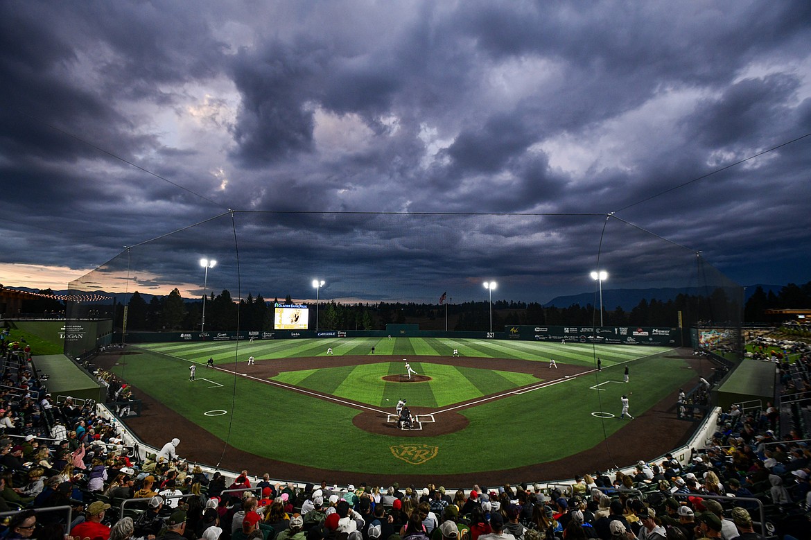 Dark clouds move across the sky over Glacier Bank Park during Game 1 of the Pioneer League Championship Series between the Glacier Range Riders and Yolo High Wheelers on Tuesday, Sept. 17. (Casey Kreider/Daily Inter Lake)