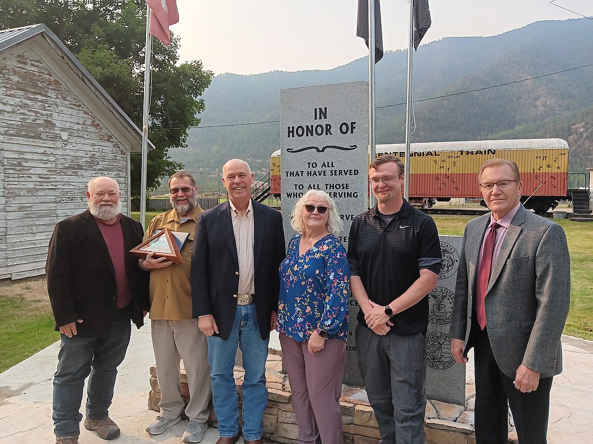 Dignitaries, family and friends of Mahlon ‘Paul’ Manson were in attendance last week for his acceptance of the Montana Governor’s Veteran Commendation in Alberton. From left to right, state Rep. Denley Loge, Paul Manson, Gov. Greg Gianforte, Paul’s wife Fran and his son Mahlon Patrick along with Alberton School Superintendent Monte Silk. (Monte Turner/Mineral Independent)