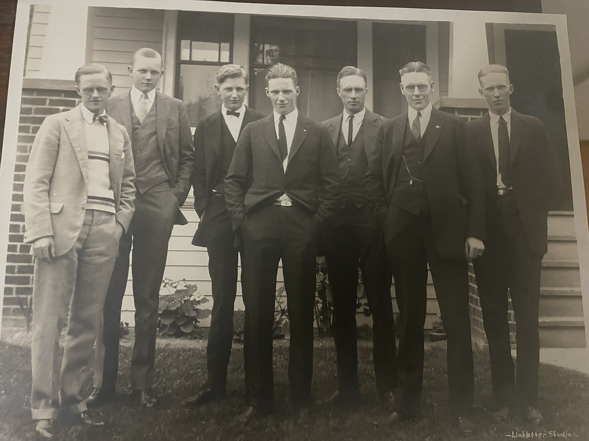 Pete Odegard, in the light-colored suit on the left, poses with his brothers outside their family home in Seattle, where they moved to get a college education. (photo provided)