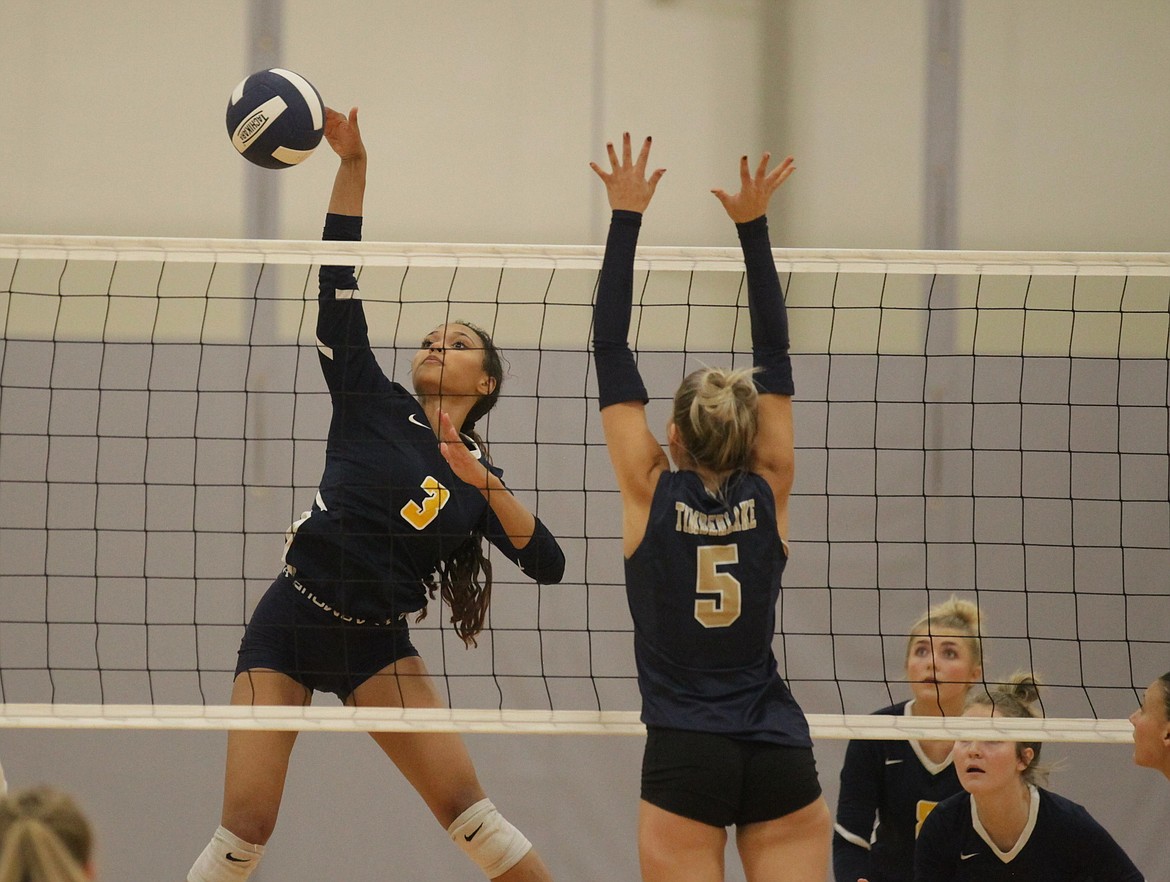 MARK NELKE/Press
Laya Daniels (3) of Genesis Prep hits against the block of Maci Sandbank (5) of Timberlake on Tuesday night at The Courts at Real Life in Post Falls.