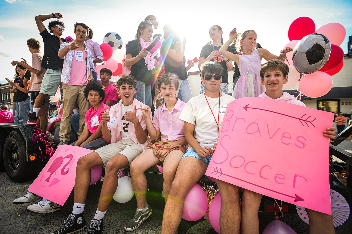 Members of the Braves soccer team ride on a float during the Flathead High School Homecoming Parade on Main Street on Wednesday, Sept. 18. (Casey Kreider/Daily Inter Lake)