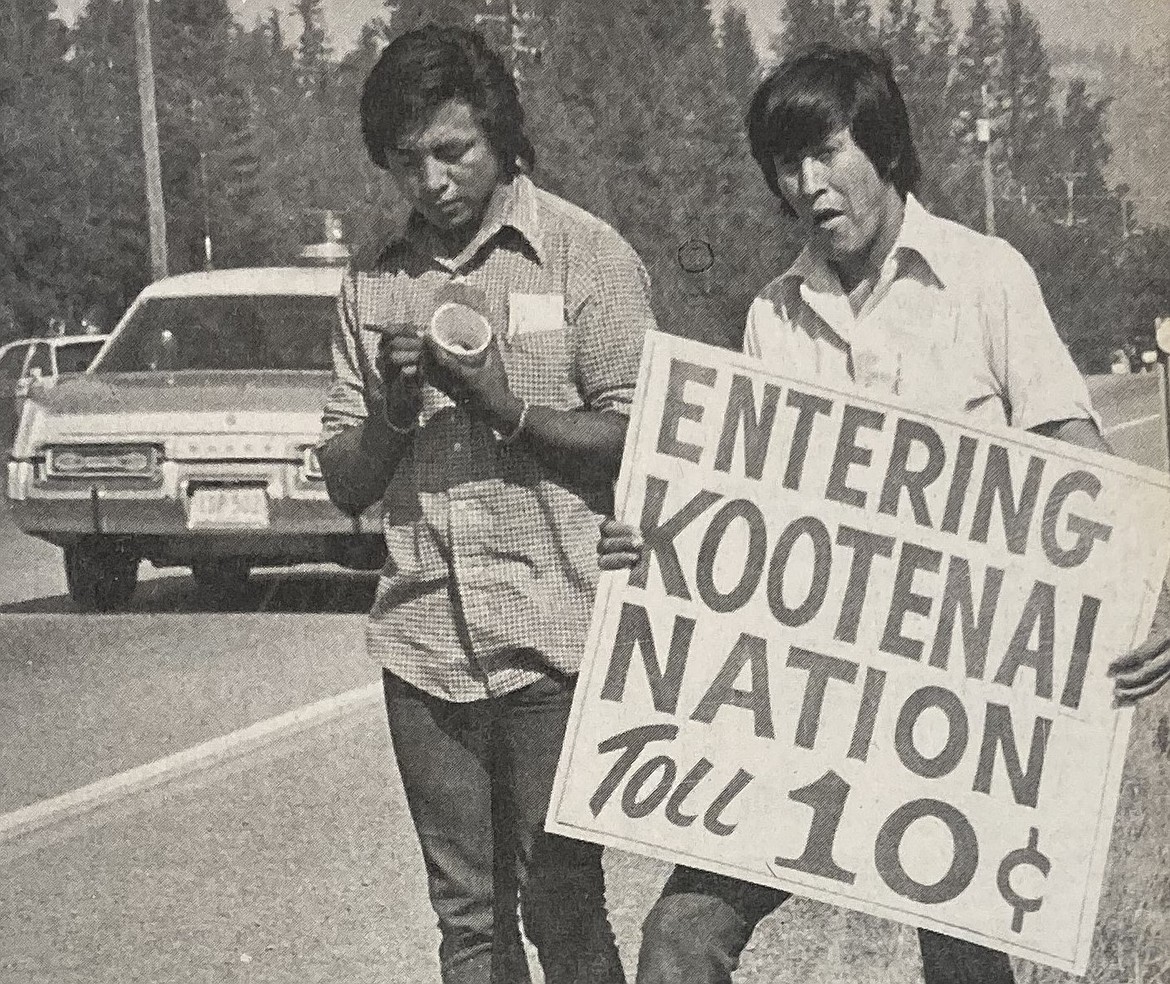 In September 1974, Ron Abraham, left, and Jimmy John, of the Kootenai Tribe, form an informal picket line as an Idaho State Police car passes by.