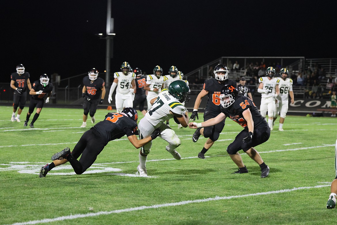 The Jacks' Maximo Serrano, junior, works to push through the Tigers defense during Friday's game. While the Jacks lost the game, they moved the ball well on the field.