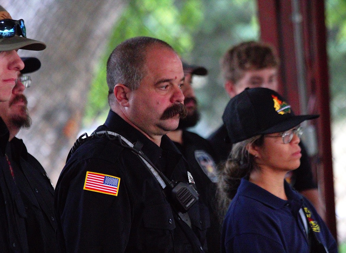 (center) Matt Solt stands with firefighters and first responders during the 9/11 Commemoration on Wednesday, Sept. 11 at the Boundary County Fairgrounds.