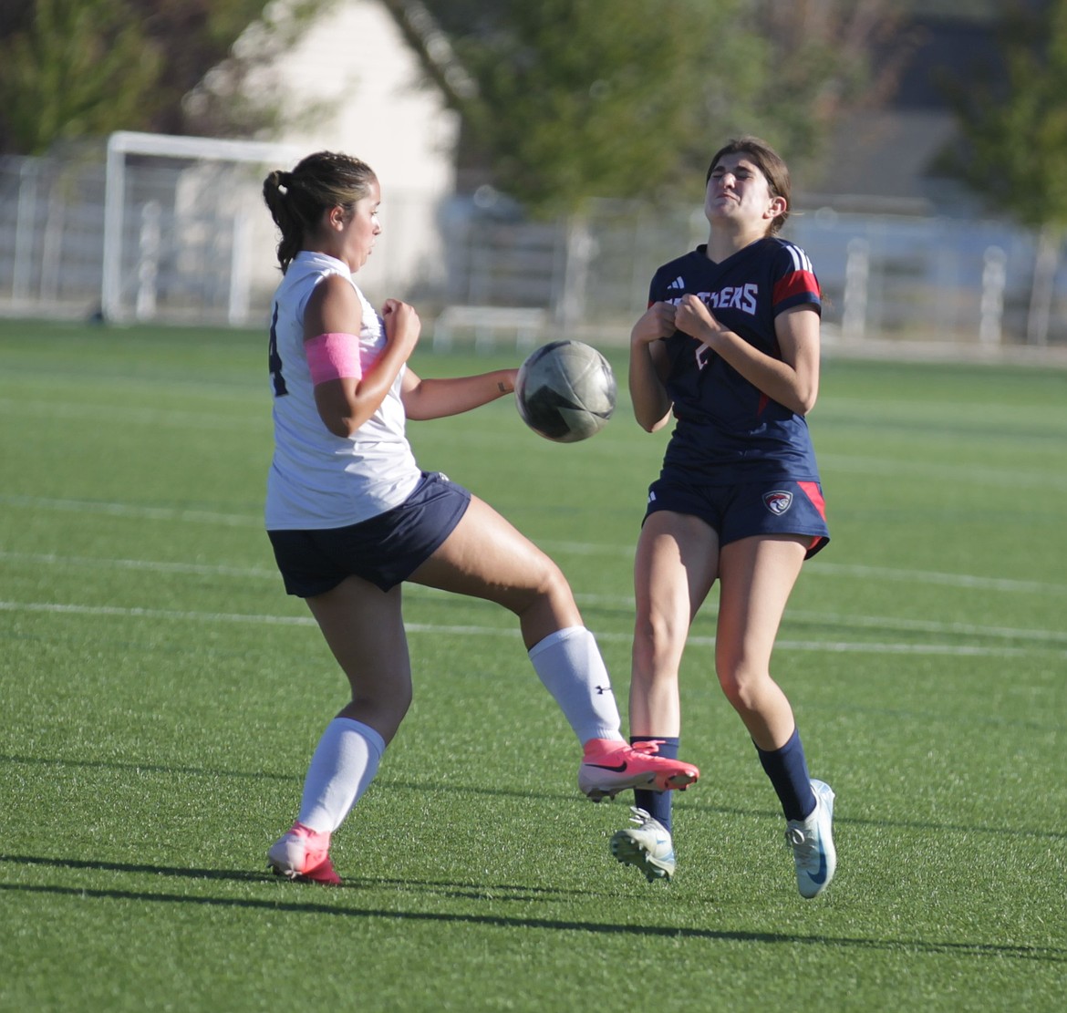 JASON ELLIOTT/Press
Coeur d'Alene Charter freshman forward Emily Tannenberger attempts to deflect a kick by Timberlake sophomore Emilia Landon during the first half of Wednesday's Intermountain League match at The Fields in Post Falls.