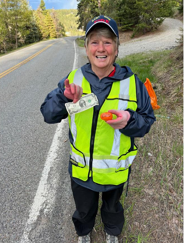 East Side Fire volunteer Amy Reagan finds treasure among trash during a past litter pickup. East Side Fire has been honored as the 2023 Outstanding Group of the Year by the Idaho Transportation Department's Adopt-A-Highway program. The volunteer fire department has collected more than 50,000 pounds of trash along Highway 97 and Burma Road over 20 years.