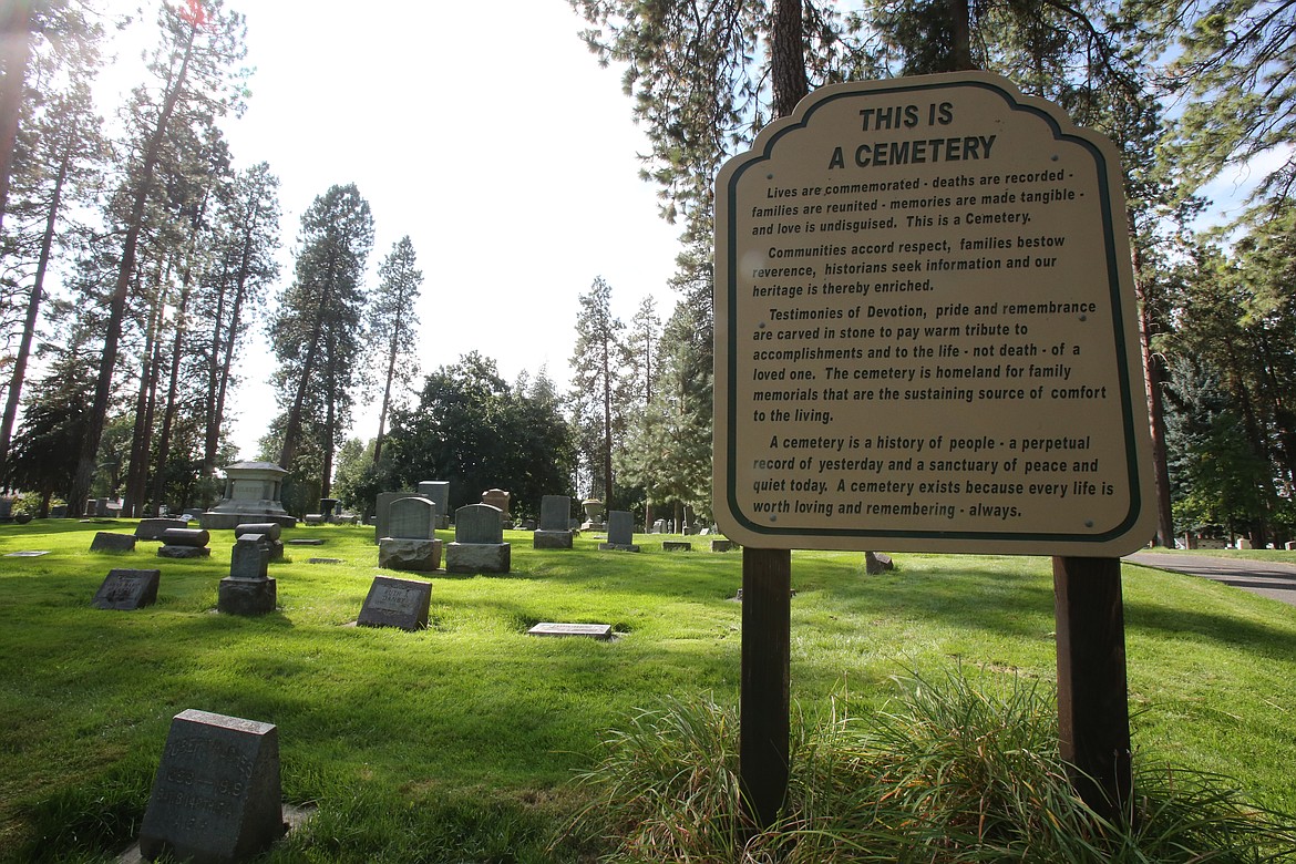 A sign in Forest Cemetery reminds visitors, "This is a cemetery. Lives are commemorated - deaths are recorded - families are reunited - memories are made tangible - and love is undisguised. This is a cemetery."