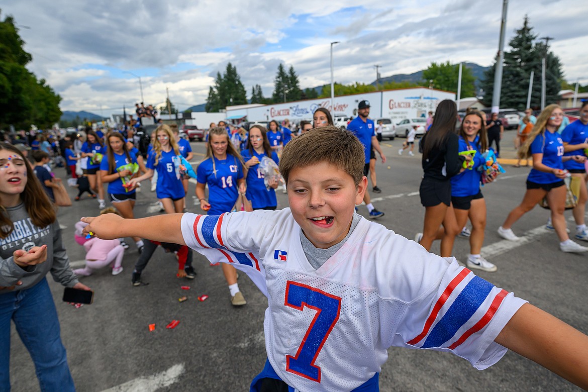 A kid messes around in the parade.