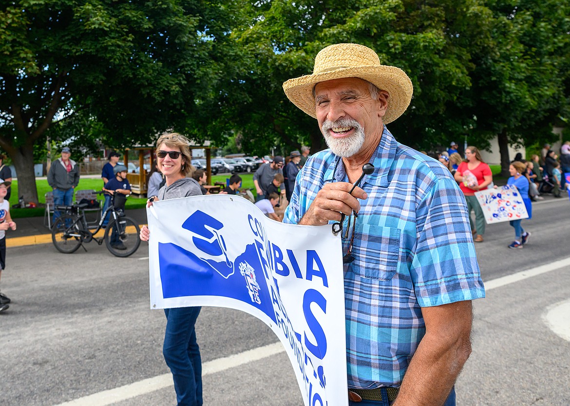 George Scherman and Alice Biel lead off the  Columbia Falls Homecoming Parade Wednesday with teh Academic Foundation float.