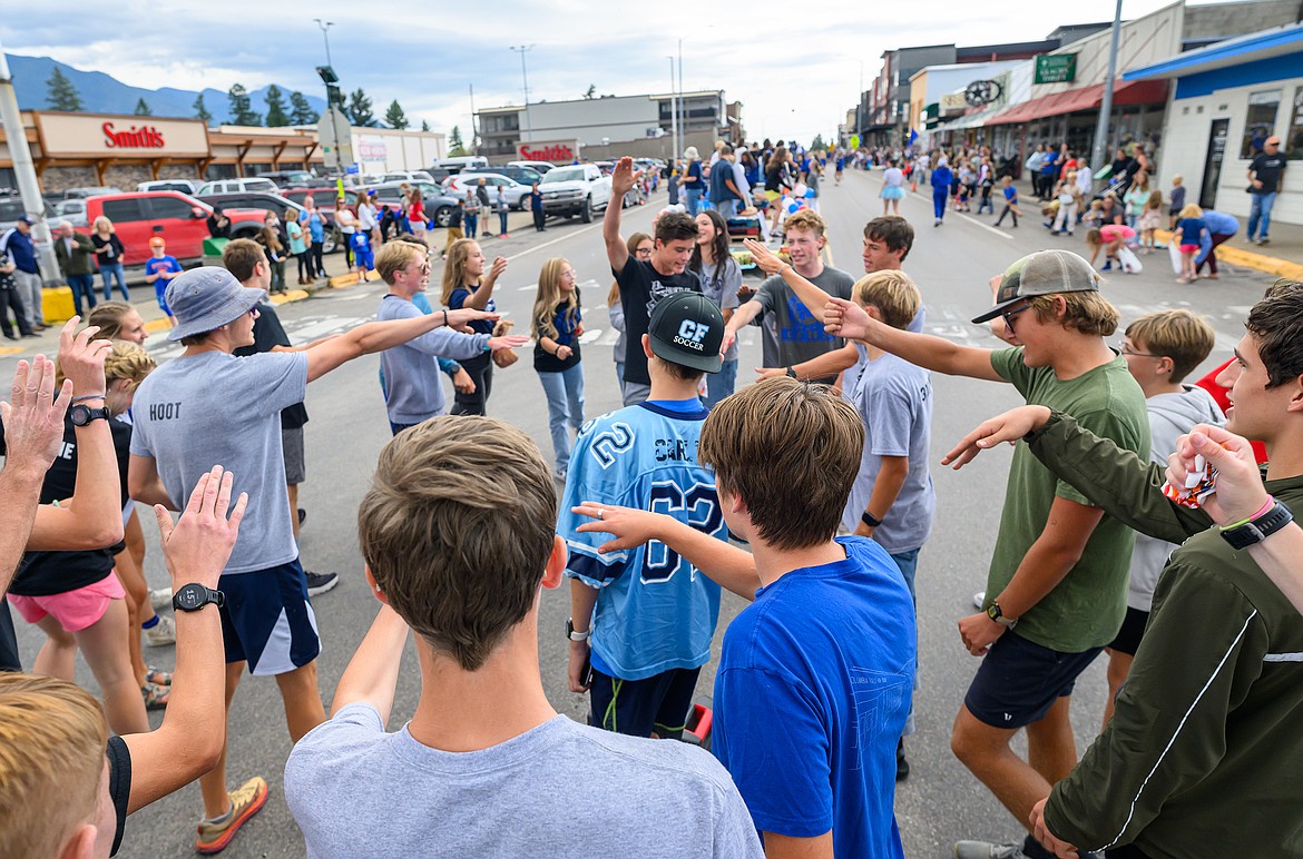 The cross country team gives a cheer.