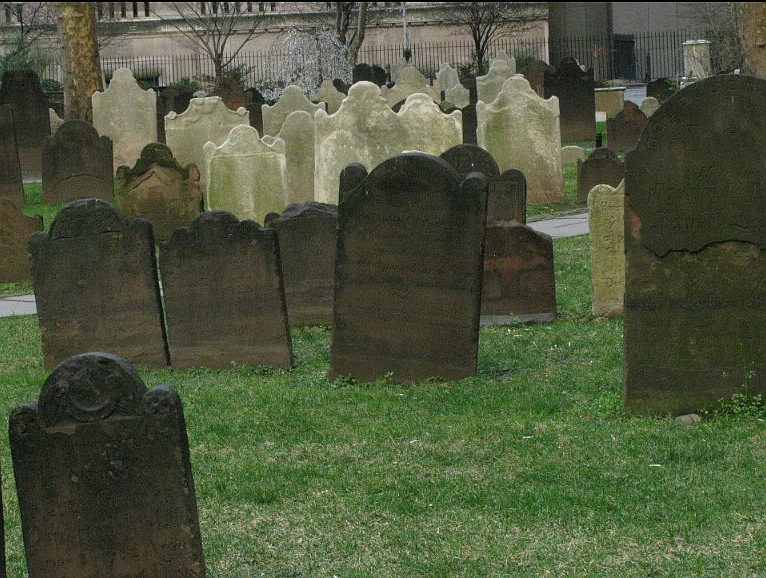 Inscriptions on the headstones in Trinity Churchyard in Manhattan have begun to fade away after hundreds of years of looking over the early Americans interred there. Some of the graves in the churchyard are seen here in spring 2011.