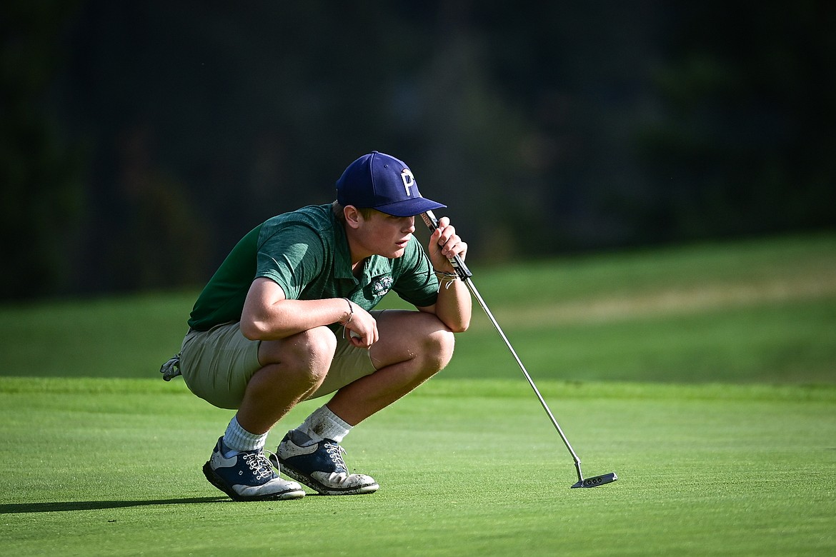 Glacier's Torren Murray looks over the line on his putt on the third hole during the Kalispell Invitational at Buffalo Hill Golf Club on Thursday, Sept. 19. (Casey Kreider/Daily Inter Lake)